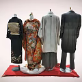 Colorful Traditional Kimono and Gray Formal Suit Outfits on Mannequins with Red Display Stand