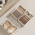 Organized Wardrobe Drawer With Compartmentalized Storage Boxes For Neatly Arranged Small Clothes
