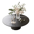 Round Marble Top Coffee Table With Clear Vase White Pink Flowers Gold Candle Holders White Candles