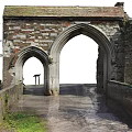 Ancient Ruined Architectural Structure With Archway Brick Walls Stone Path And Water
