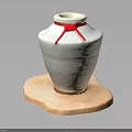 White Ceramic Jar With Red Ribbon On Irregular Wooden Base Against Dark Background
