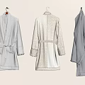Plush Towel Bathrobes Hanging On Wall In Light Gray Beige And Dark Gray