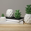 White And Green Pineapple Shaped Decorative Ornament Set On Stacked Books For Wooden Tabletop Decoration