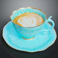 Light Blue Teacup and Saucer with Gold Floral Patterns Holding Latte with Swirl Art
