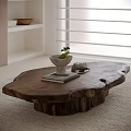 Natural Edge Wooden Coffee Table with Stone Bowl Green Plant Books and Metal Tray