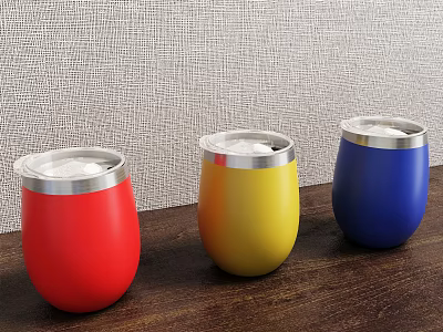 Vibrant Red Yellow Blue Tumblers With Silver Rim Placed On Wooden Table 3d model