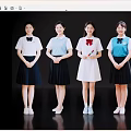 Young women smiling in different color school uniforms standing in a row against black background
