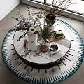 Elegant Round Glass Coffee Table With Flower Vases Tray Nuts And Cup By Window