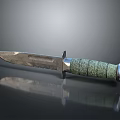 Tactical Combat Dagger With Green Textured Handle And Sharp Metal Blade On Reflective Surface