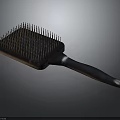 Stylish Hair Comb With Black Handle Dense Bristles And Silver Accent