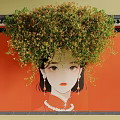 Lush Green Vines Hanging Over Traditional Qipao Woman On Red Wall With Eaves