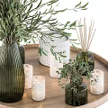 Green Ribbed Vase Holding Olive Branches On Wooden Tray With Black Statue And Candle