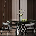 Modern Round Glass Top Dining Table Set with Grey Chairs Vase Flowers and Green Apples