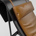 Modern Leather Lounge Chair With Brown Upholstery And Black Metal Frame Design