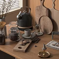 Modern Kitchen Utensils With Kettle Coffee Pot Wooden Cutting Boards And Glass Jars On Countertop