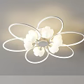Modern White Flower Shaped Chandelier Featuring Circular Petal Rings And Multiple White Lamp Shades