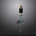 Electronic Device With Black Cylindrical Body Yellow Top Component Blue Pillar And Gray Base