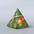 Traditional Chinese Zongzi Wrapped in Green Bamboo Leaves with Salted Egg Yolk Fillings