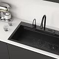Black Kitchen Sink With Running Water Coffee Maker And Glasses On White Countertop