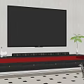 Large Black TV On Modern Gray TV Stand With Red Drawer Cat And Potted Plant