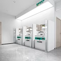 Bank Interior With Row Of White ATM Machines And Green Signage On Gray Floor