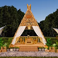CASA DONOH Campsite Featuring Wooden Triangle Structure Green Plants Platform And Surrounding Trees