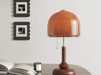 Table Lamp With Wooden Base Orange Glass Shade Near Open Book Jar And Framed 3d model