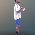 Man in white Adidas T-shirt and blue shorts holding a soccer ball