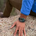 Smart Watch With Digital Display Worn On Wrist During Outdoor Activity On Rock
