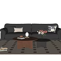 Stylish Black Leather Sofa With Decorative Cushions And Round Coffee Table Set On Geometric Rug