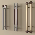 Stylish Door Handles with Various Metal Finishes and Decorative Designs Mounted on Beige Wall