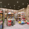 Organized Specialty Store Interior With Shelves Of Daily Products And Food Items