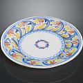Decorative Ceramic Plate With Blue White Base Colorful Floral Patterns And Central Blue Wreath