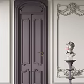 Classic Deep Gray Hinged Door With Carved Design And Decorative Wall Statue