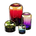 Set Of Four Colorful Ceramic Vases With Gradient Hues And Glossy Modern Design