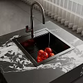 Modern Kitchen Sink Space Featuring Black Sink Faucet Marble Countertop And Fresh Apples