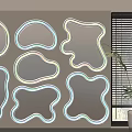 Irregularly Shaped White Framed Mirrors On Wall With Window Blinds And Potted Plant 3d model