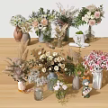 Assorted Fresh And Dried Flowers In Glass Ceramic Vases With Baby's Breath On Wooden Table