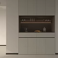 Modern Sideboard with Light Cabinet Doors and Glassware on Dark Countertop with Kettle and Fruits