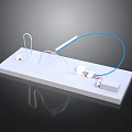 Electronic Components Model With White Platform Blue Wires Connectors And Gray Box