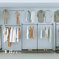 Clothes Hangers Displaying Neutral Tones Dresses Shirts And Coats In Retail Boutique