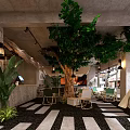 Cozy Café Interior Design With Large Tree Green Plants And Concrete Walls
