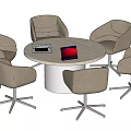 Modern Round Table And Upholstered Chairs Set With Laptop And Magazine On Top