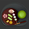 Assorted Japanese Traditional Sweets With Colorful Shapes On Red Tray And Matcha Bowl