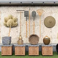 Traditional Industrial Equipment Display with Brooms Rakes Baskets on Wooden Stone Platforms Stone Wall Background