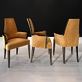 Tan Upholstered Armchairs With Dark Wood Legs And Modern Design