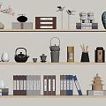 Stylish Books And Magazines Arranged On Shelves With Decorative Vases Teapots And Statues