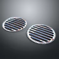 Two Round Metal Grilles With Striped Design On Dark Background