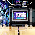 Modern KTV Lounge Interior With Large Screen Colorful Lighting Leather Sofa And Drinks