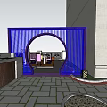 Courtyard Garden with Arched Wooden Gate Autumn Leafy Tree Outdoor Seating and Stone Paved Ground